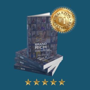 Be Brand Rich book stack showing the No.1 Bestseller gold medal from Amazon and 5 star reviews.