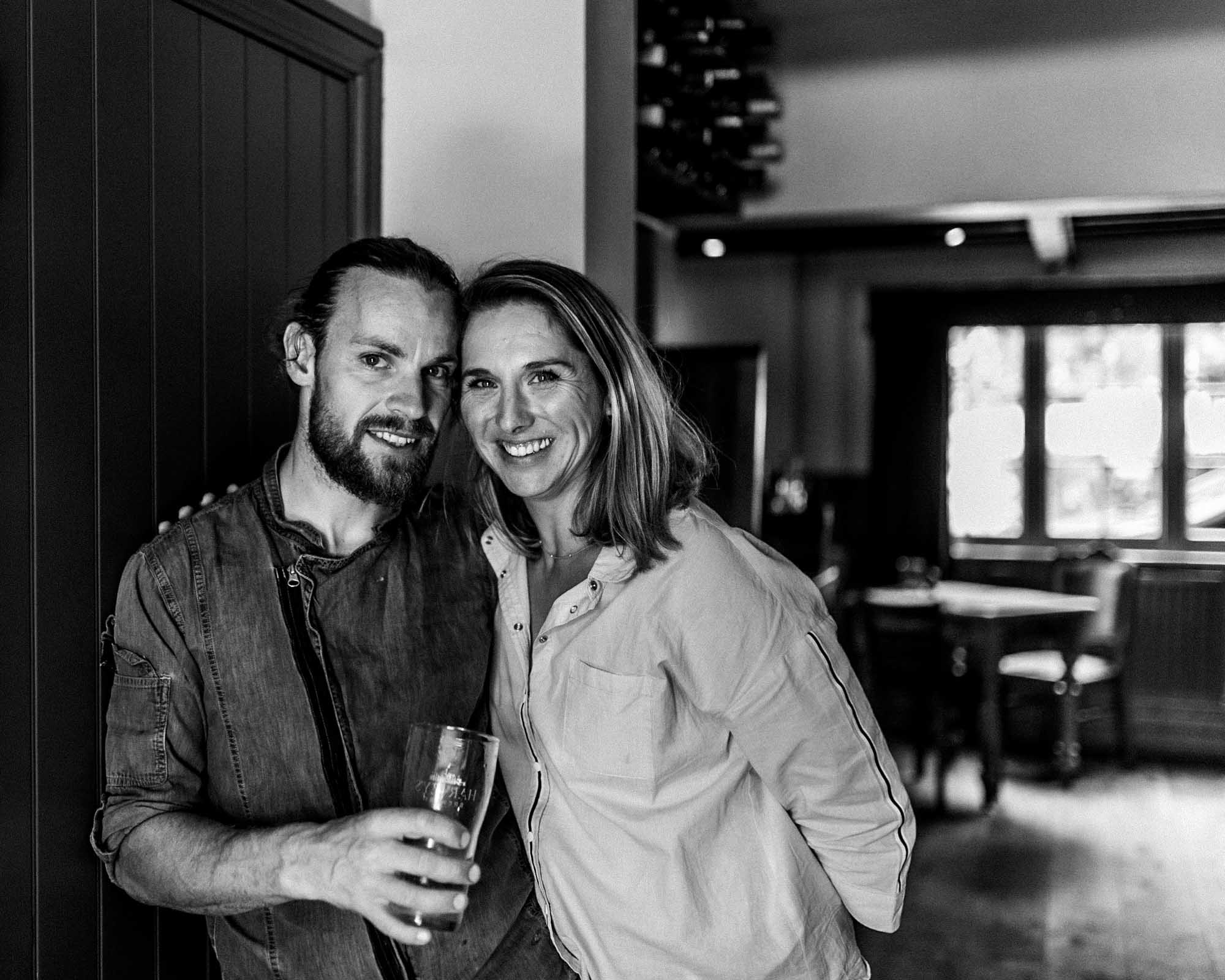 Husband & wife team headshot in B&W