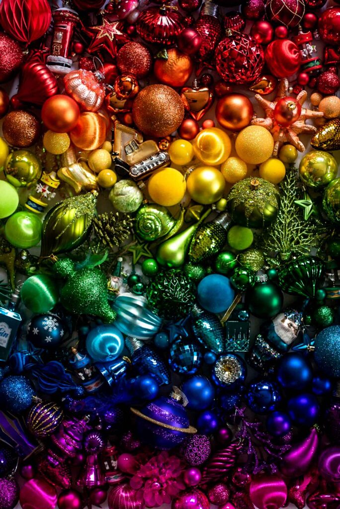 Rainbow Christmas Baubles laid out in spectrum order