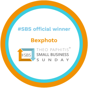 Circular badge with orange and turquoise rings, reading “#SBS official winner - Bexphoto” above the orange and blue Theo Paphitis Small Business Sunday logo.